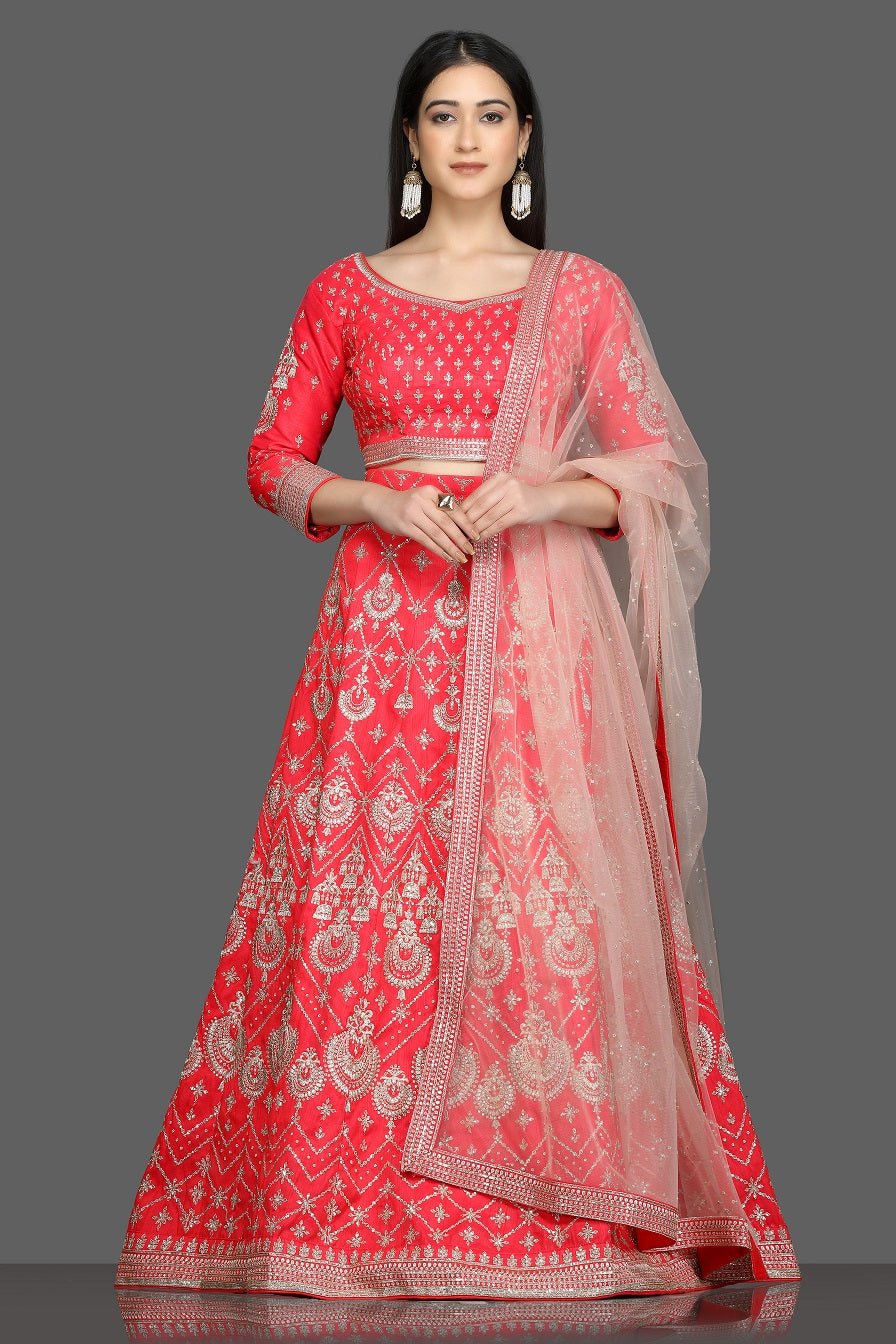 Buy stunning tomato red embroidered designer lehenga online in USA with net dupatta. Flaunt your sartorial choices on special occasions with beautiful designer gowns, Anarkali suits, traditional salwar suits, Indian lehengas from Pure Elegance Indian fashion boutique in USA. -full view