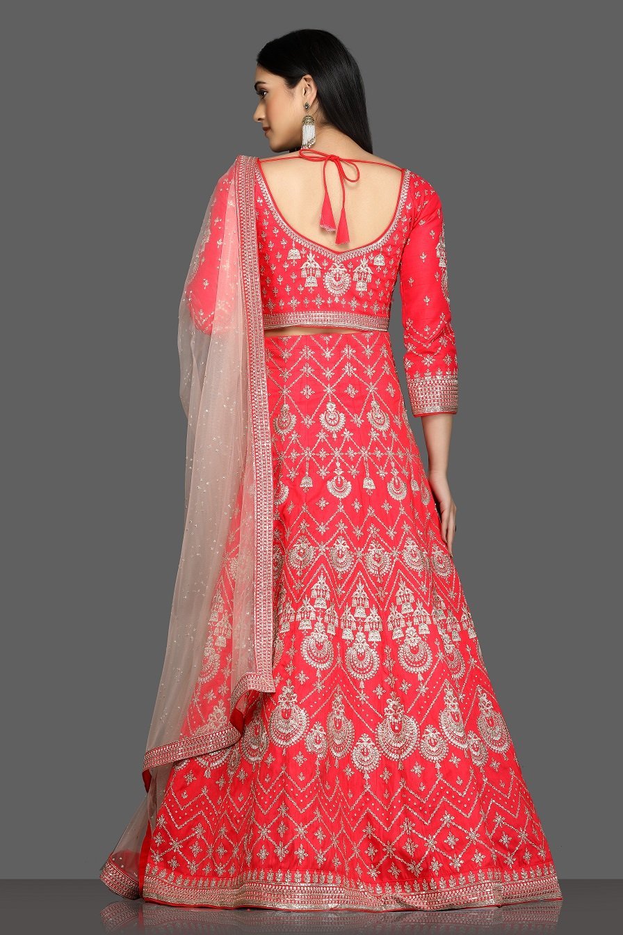 Buy stunning tomato red embroidered designer lehenga online in USA with net dupatta. Flaunt your sartorial choices on special occasions with beautiful designer gowns, Anarkali suits, traditional salwar suits, Indian lehengas from Pure Elegance Indian fashion boutique in USA. -back
