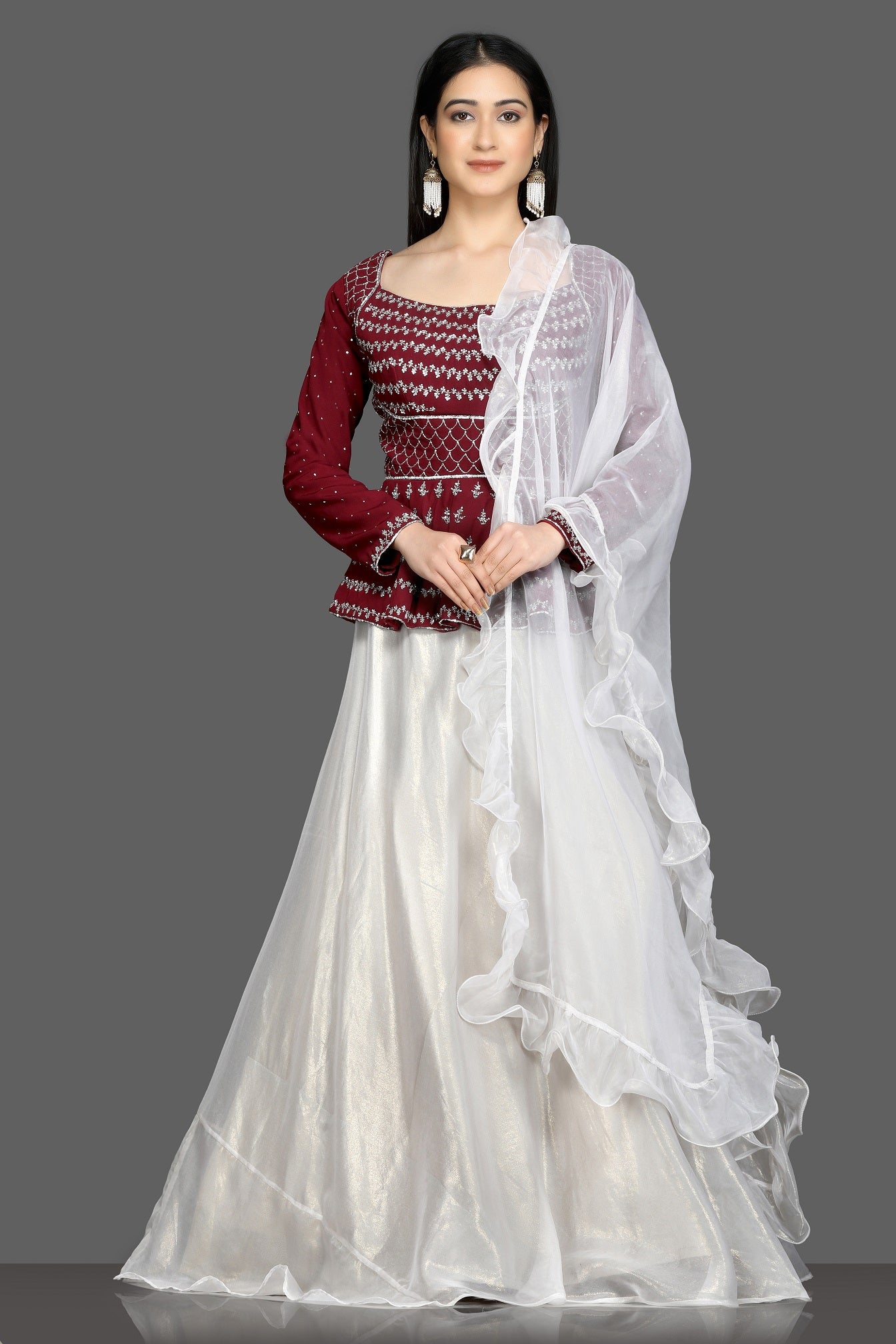 Buy stunning wine and white embroidered lehenga online in USA with white ruffle dupatta. Flaunt your sartorial choices on special occasions with beautiful designer gowns, Anarkali suits, traditional salwar suits, Indian lehengas from Pure Elegance Indian fashion boutique in USA. -full view