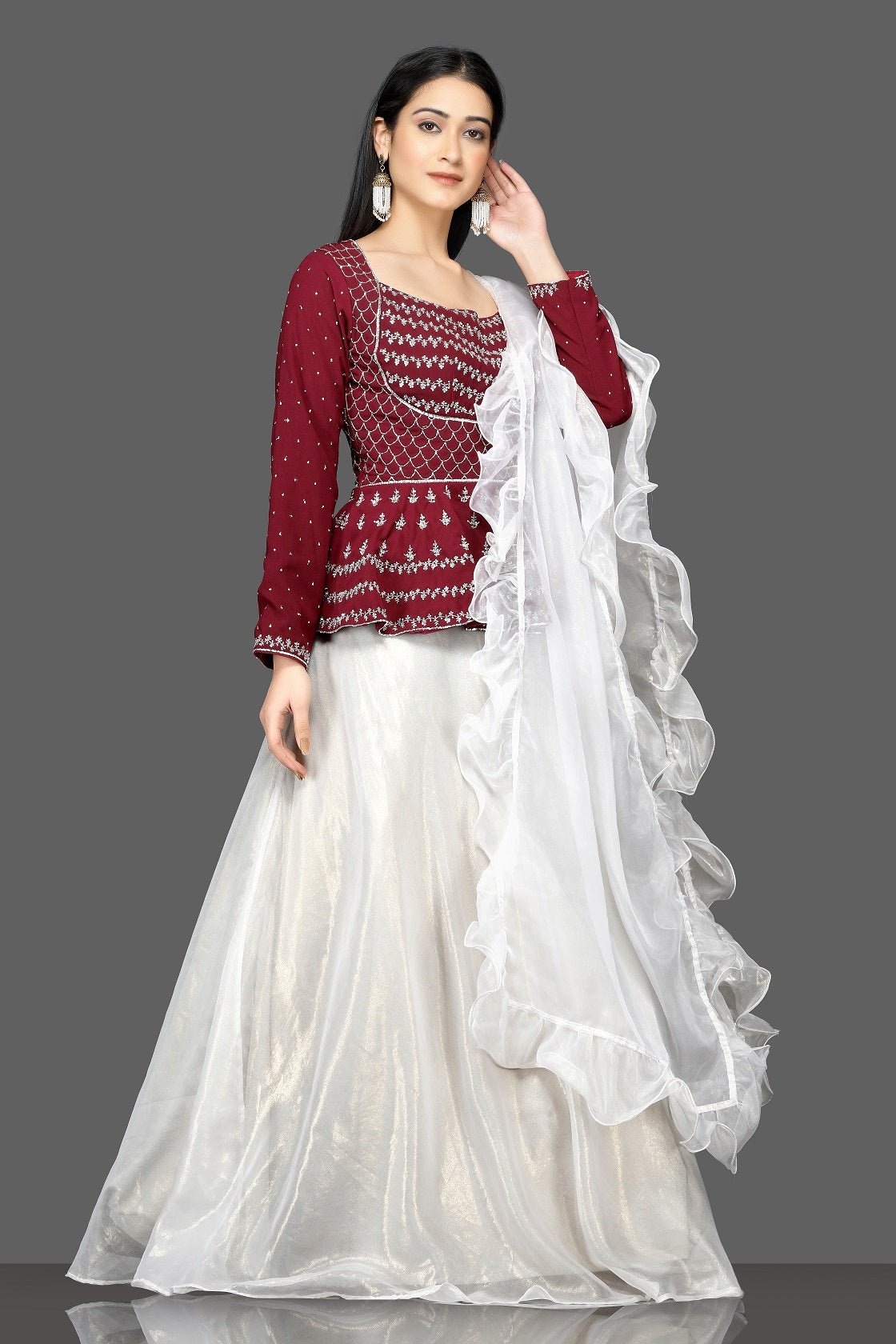 Buy stunning wine and white embroidered lehenga online in USA with white ruffle dupatta. Flaunt your sartorial choices on special occasions with beautiful designer gowns, Anarkali suits, traditional salwar suits, Indian lehengas from Pure Elegance Indian fashion boutique in USA. -right