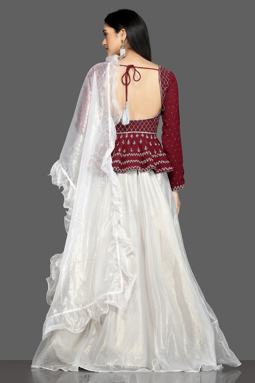 Buy stunning wine and white embroidered lehenga online in USA with white ruffle dupatta. Flaunt your sartorial choices on special occasions with beautiful designer gowns, Anarkali suits, traditional salwar suits, Indian lehengas from Pure Elegance Indian fashion boutique in USA. -back