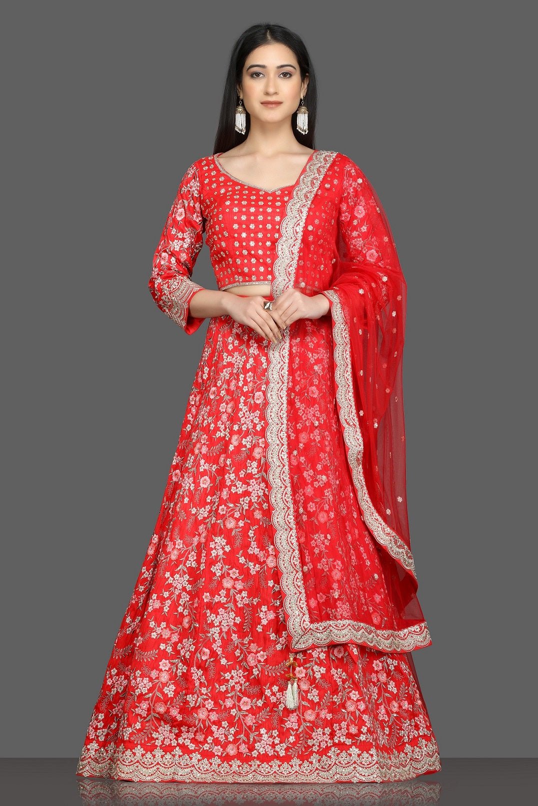 Shop beautiful tomato red embroidered lehenga online in USA with net dupatta. Flaunt your sartorial choices on special occasions with beautiful designer gowns, Anarkali suits, traditional salwar suits, Indian lehengas from Pure Elegance Indian fashion boutique in USA. -full view