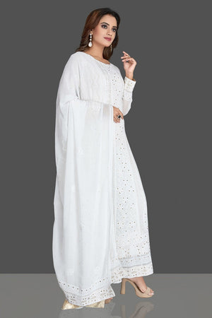 Buy gorgeous white georgette Lucknowi chikankari work Anarkali suit online in USA. Flaunt your sartorial choice with beautiful embroidered Anarkali, sharara suits, designer lehengas, designer gowns from Pure Elegance Indian saree store in USA.-side