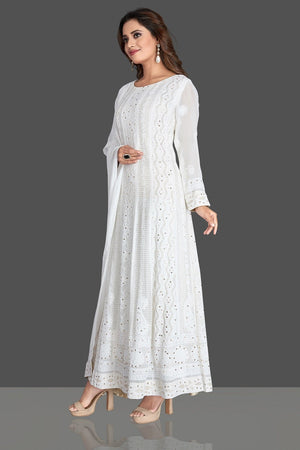 Buy gorgeous white georgette Lucknowi chikankari work Anarkali suit online in USA. Flaunt your sartorial choice with beautiful embroidered Anarkali, sharara suits, designer lehengas, designer gowns from Pure Elegance Indian saree store in USA.-left