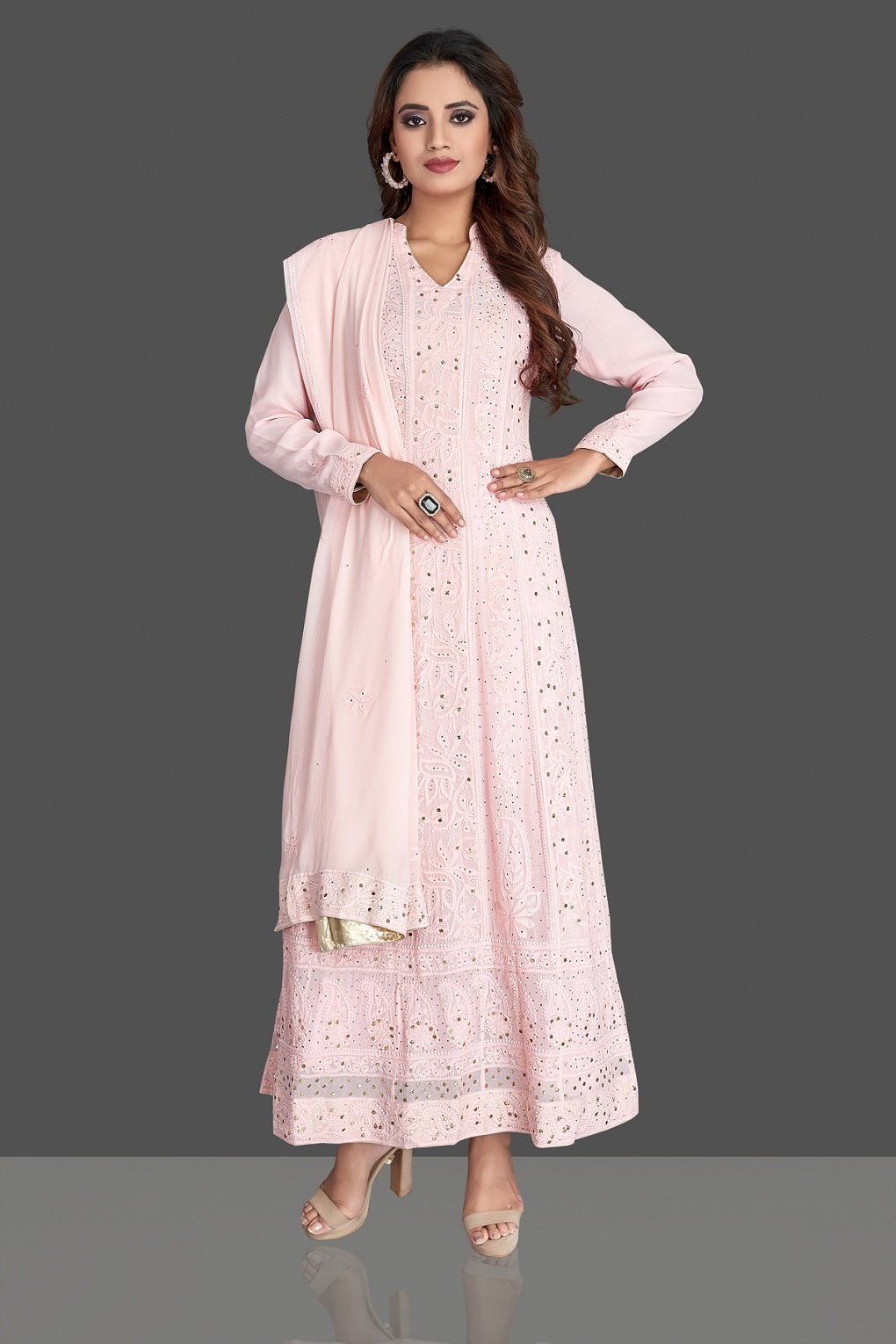 Shop beautiful powder pink Lucknowi chikankari work georgette Anarkali suit online in USA. Flaunt your sartorial choice with beautiful embroidered Anarkali, sharara suits, designer lehengas, designer gowns from Pure Elegance Indian saree store in USA.-front