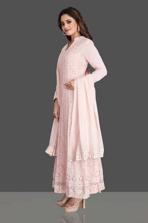 Shop beautiful powder pink Lucknowi chikankari work georgette Anarkali suit online in USA. Flaunt your sartorial choice with beautiful embroidered Anarkali, sharara suits, designer lehengas, designer gowns from Pure Elegance Indian saree store in USA.-side