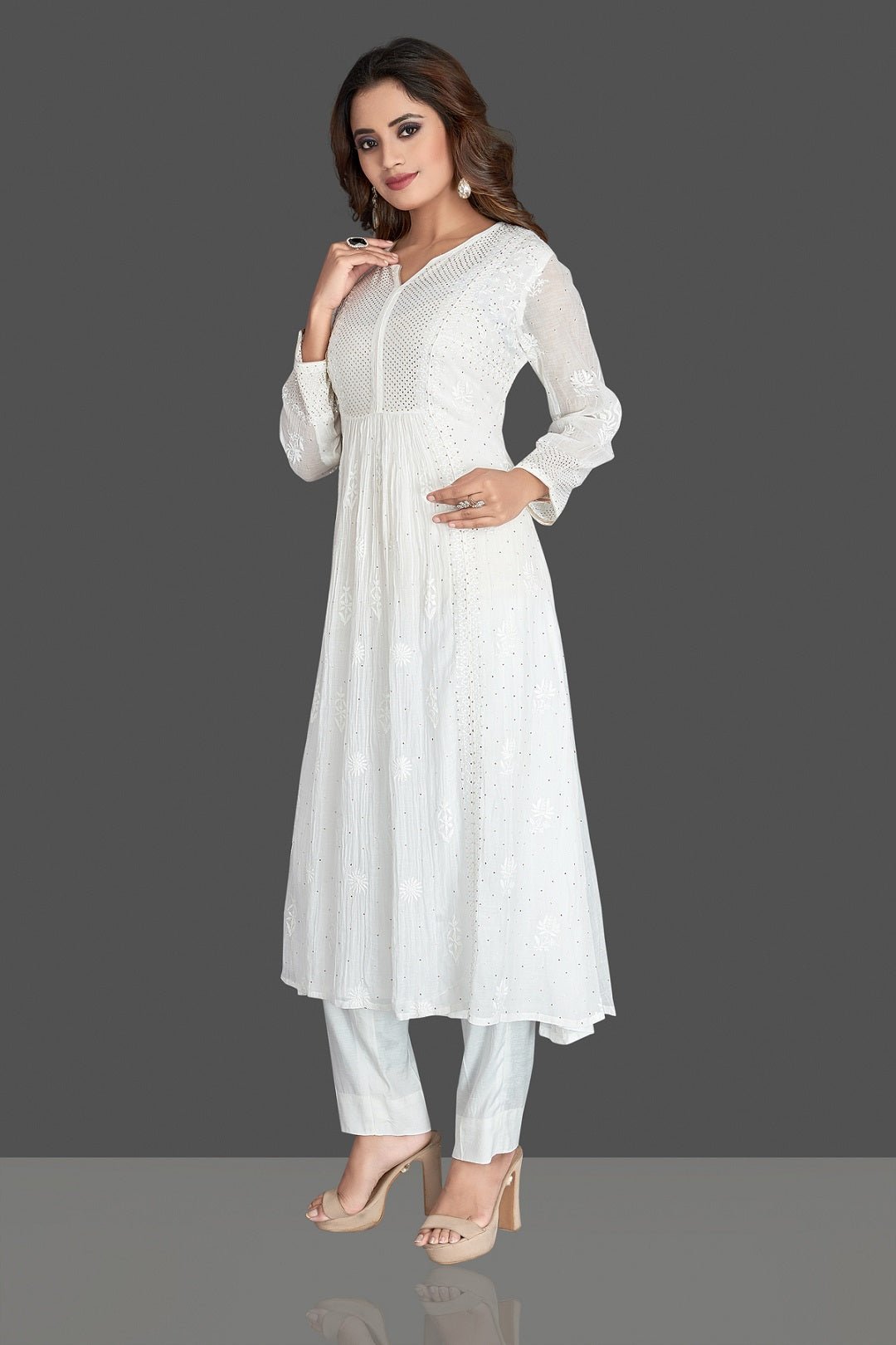 Shop stunning white georgette Lucknowi chikankari suit online in USA. Flaunt your sartorial choice with beautiful embroidered Anarkali, sharara suits, designer lehengas, designer gowns from Pure Elegance Indian saree store in USA.-left