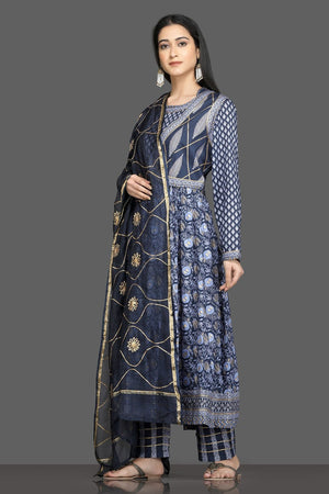 Shop beautiful blue printed silk suit online in USA with waist coat and dupatta. Shop for parties and festive occasions stunning designer suits, Anarkali suits, designer gowns, wedding lehengas from Pure Elegance Indian fashion store in USA.-left