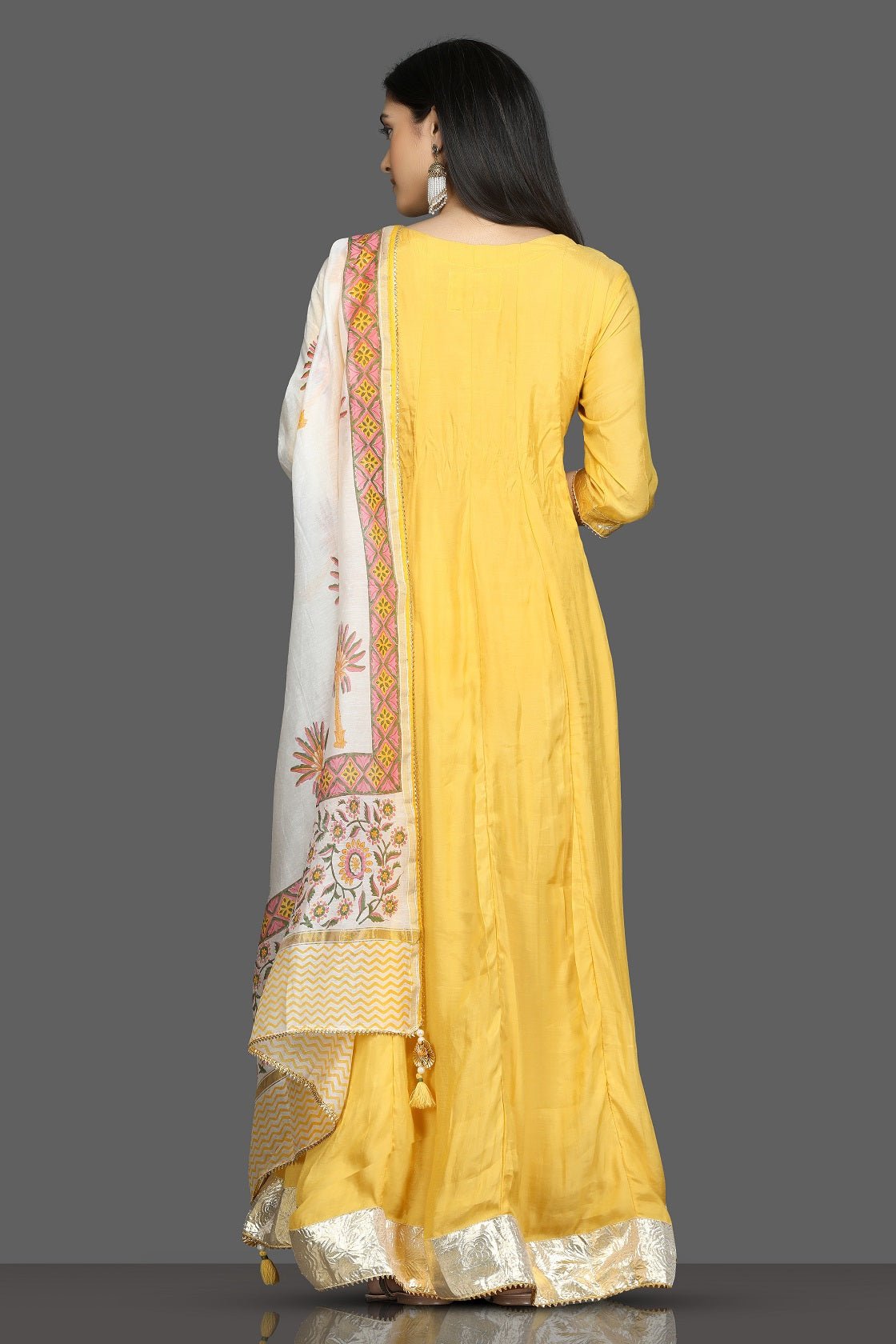Buy beautiful yellow silk floorlength Anarkali suit online in USA with printed dupatta. Shop for parties and festive occasions stunning designer suits, Anarkali suits, designer gowns, wedding lehengas from Pure Elegance Indian fashion store in USA.-back