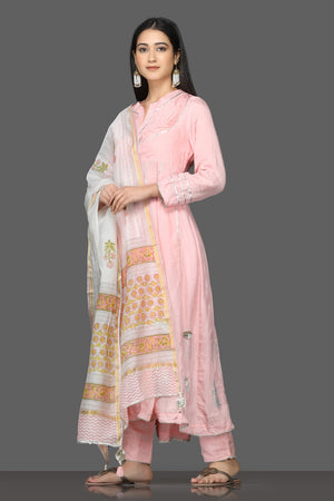 Shop stunning pink gota work silk suit online in USA with white printed dupatta. Shop for parties and festive occasions stunning designer suits, Anarkali suits, designer gowns, wedding lehengas from Pure Elegance Indian fashion store in USA.-left