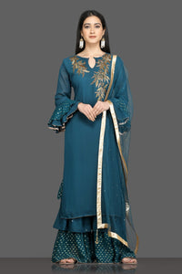Shop beautiful teal green embroidered silk suit online in USA with net dupatta. Shop for parties and festive occasions stunning designer suits, Anarkali suits, designer gowns, wedding lehengas from Pure Elegance Indian fashion store in USA.-front