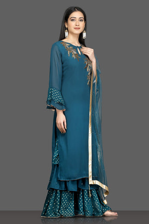 Shop beautiful teal green embroidered silk suit online in USA with net dupatta. Shop for parties and festive occasions stunning designer suits, Anarkali suits, designer gowns, wedding lehengas from Pure Elegance Indian fashion store in USA.-side