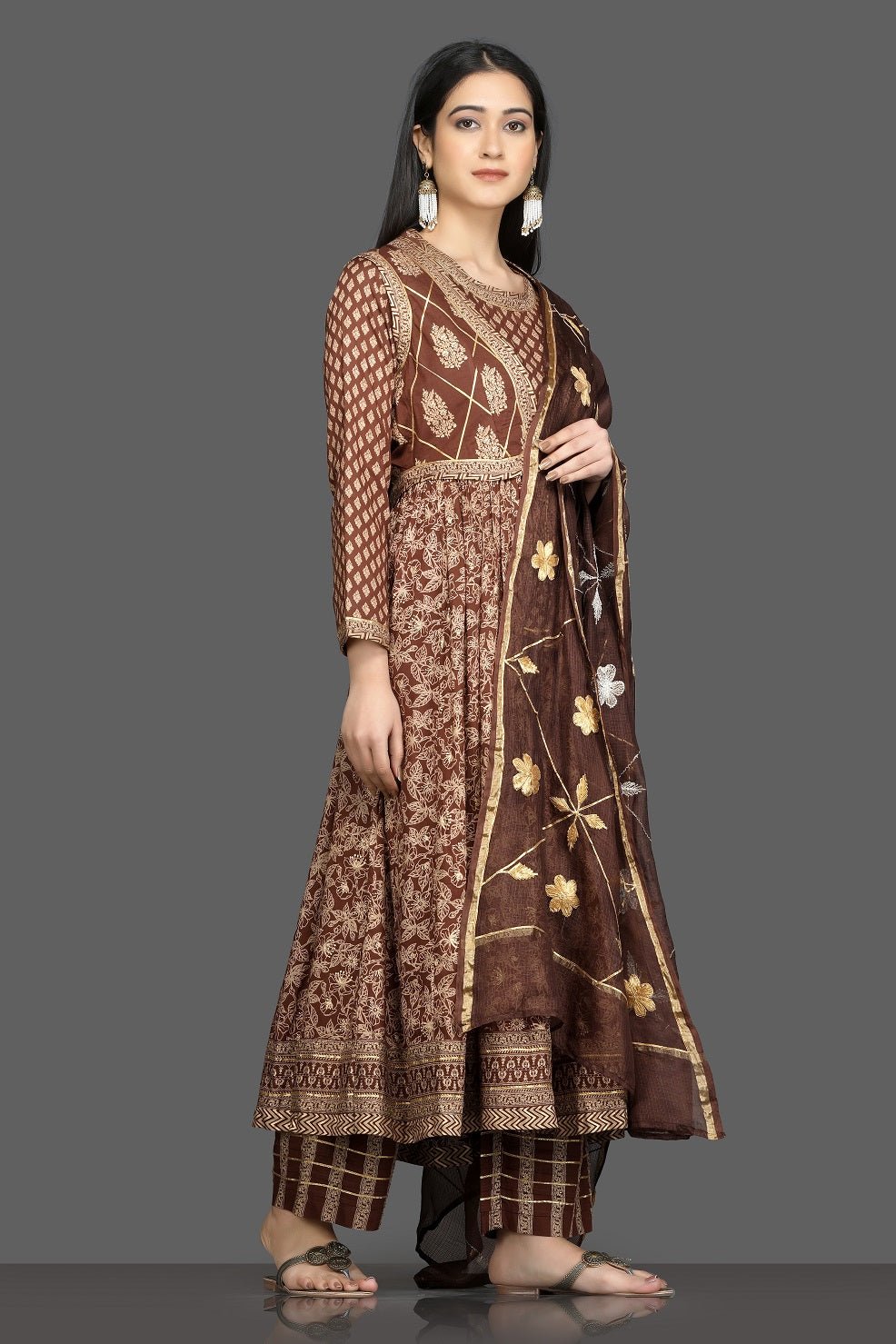 Buy beautiful brown printed silk Anarkali suit online in USA with waist jacket and dupatta. Shop for parties and festive occasions stunning designer suits, Anarkali suits, designer gowns, wedding lehengas from Pure Elegance Indian fashion store in USA.-side