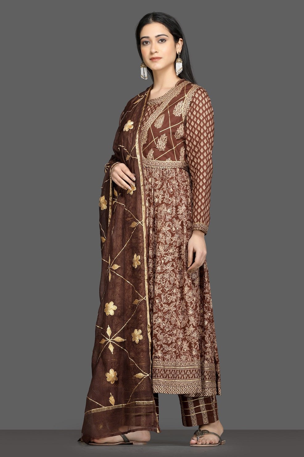 Buy beautiful brown printed silk Anarkali suit online in USA with waist jacket and dupatta. Shop for parties and festive occasions stunning designer suits, Anarkali suits, designer gowns, wedding lehengas from Pure Elegance Indian fashion store in USA.-left