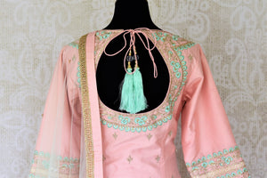 Buy gorgeous light pink and mint green hand embroidery silk suit online in USA with dupatta. Complete your ethnic look on special occasions with stunning designer Indian suits, Anarkali suits, designer dresses in USA from Pure Elegance Indian fashion store in USA.-back