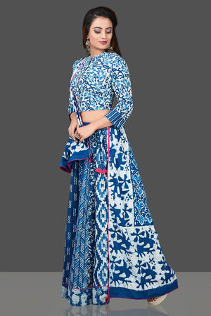 Buy beautiful blue and white Bagru block print skirt set with dupatta. Shop designer Indian clothing, wedding lehengas, designer Anarkali, gharara suits, Indian dresses in USA from Pure Elegance Indian fashions store for parties and special occasions.-left