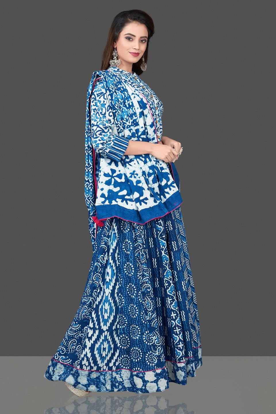 Buy beautiful blue and white Bagru block print skirt set with dupatta. Shop designer Indian clothing, wedding lehengas, designer Anarkali, gharara suits, Indian dresses in USA from Pure Elegance Indian fashions store for parties and special occasions.-side
