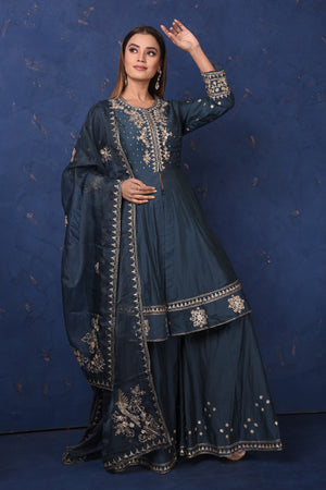 Buy beautiful dark blue embroidered sharara suit online in USA with dupatta, Be the center of attraction on festive occasions in beautiful designer suits, dresses, lehengas, designer gowns, from Pure Elegance Indian fashion store in USA.-front