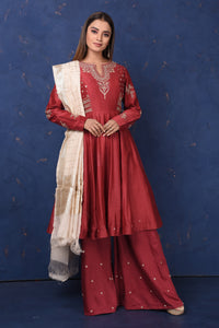 Shop gorgeous maroon embroidered sharara suit online in USA with dupatta, Be the center of attraction on festive occasions in beautiful designer suits, dresses, lehengas, designer gowns, from Pure Elegance Indian fashion store in USA.-full view