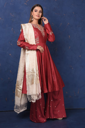 Shop gorgeous maroon embroidered sharara suit online in USA with dupatta, Be the center of attraction on festive occasions in beautiful designer suits, dresses, lehengas, designer gowns, from Pure Elegance Indian fashion store in USA.-side