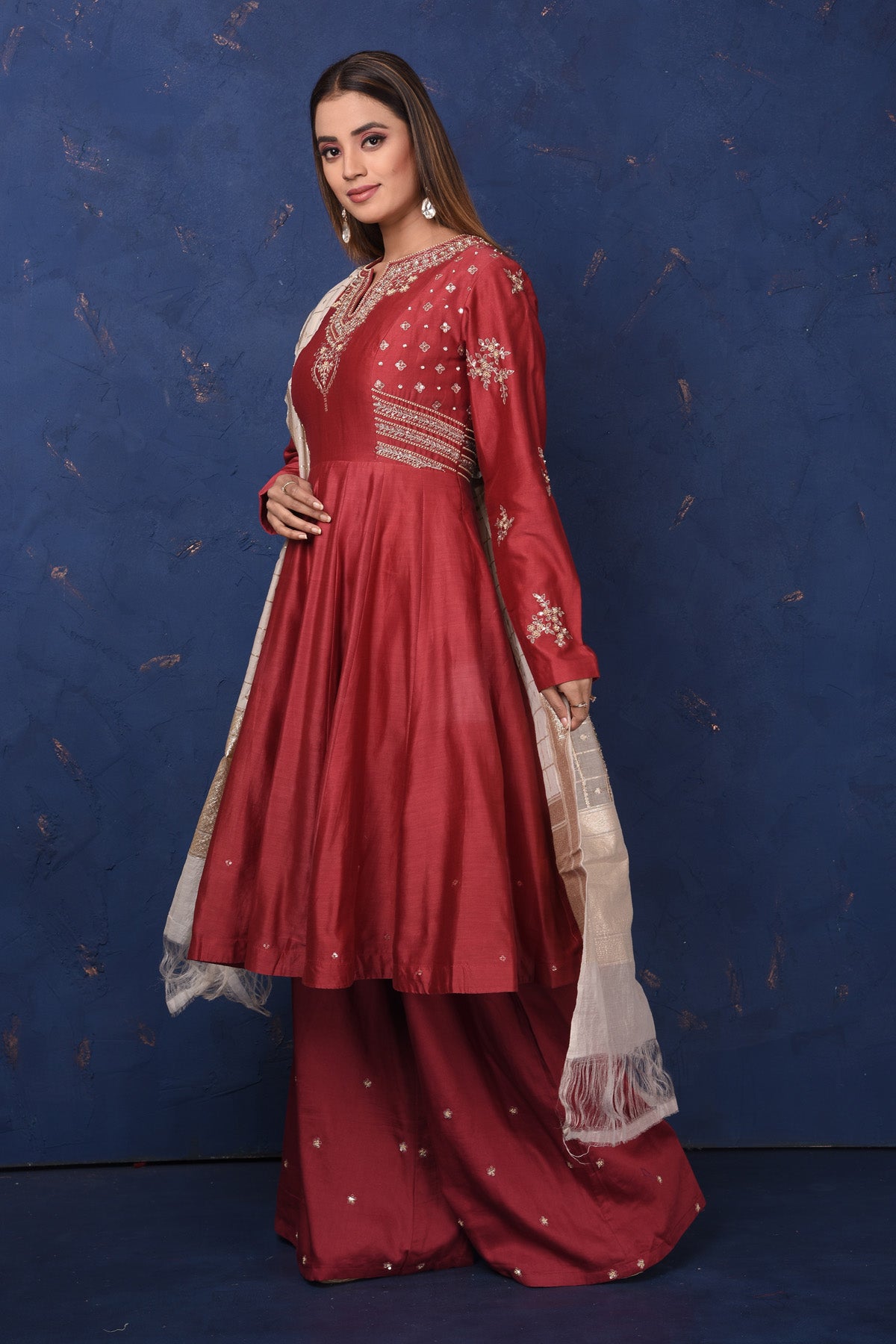 Shop gorgeous maroon embroidered sharara suit online in USA with dupatta, Be the center of attraction on festive occasions in beautiful designer suits, dresses, lehengas, designer gowns, from Pure Elegance Indian fashion store in USA.-left