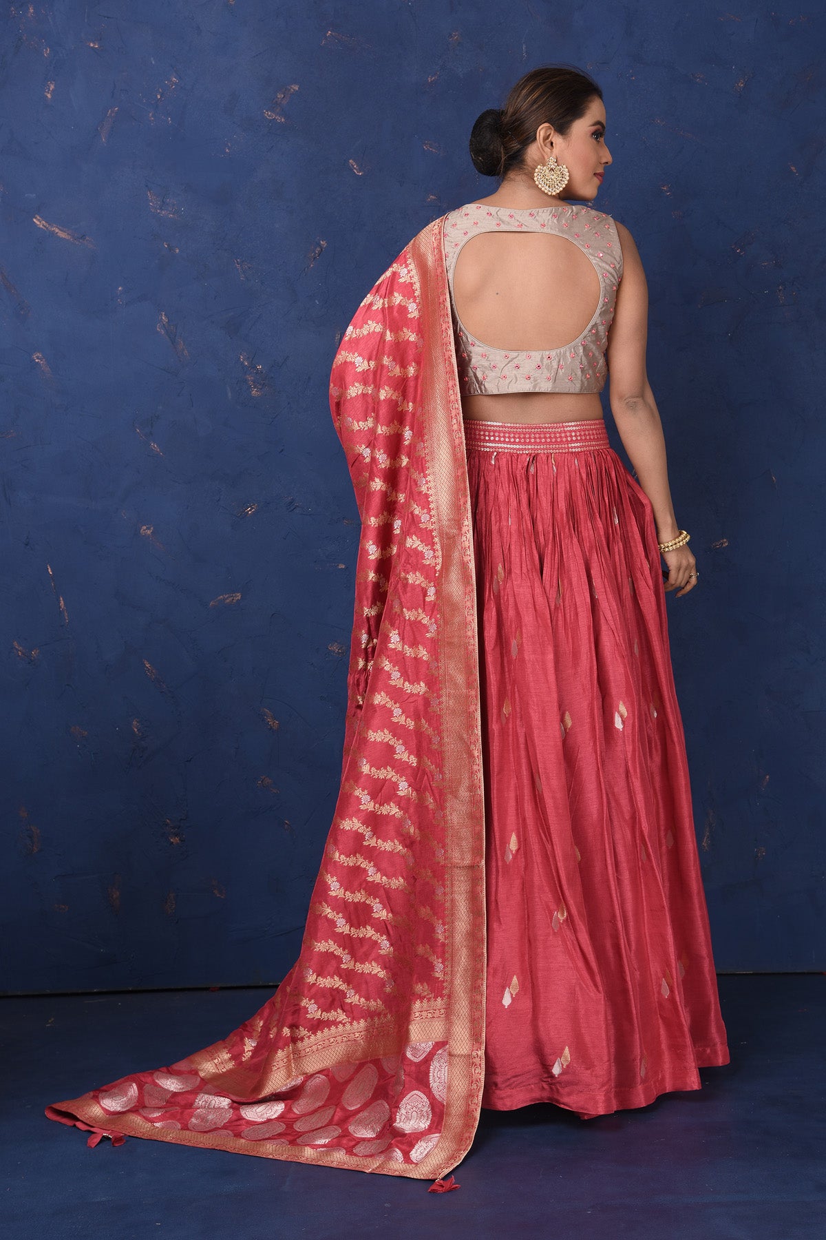 Shop stunning blush pink embroidered lehenga online in USA with dupatta, Be the center of attraction on festive occasions in beautiful designer suits, dresses, lehengas, designer gowns, from Pure Elegance Indian fashion store in USA.-back