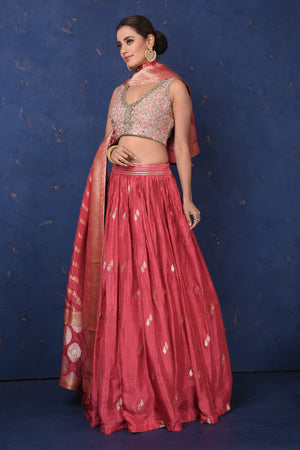 Shop stunning blush pink embroidered lehenga online in USA with dupatta, Be the center of attraction on festive occasions in beautiful designer suits, dresses, lehengas, designer gowns, from Pure Elegance Indian fashion store in USA.-side