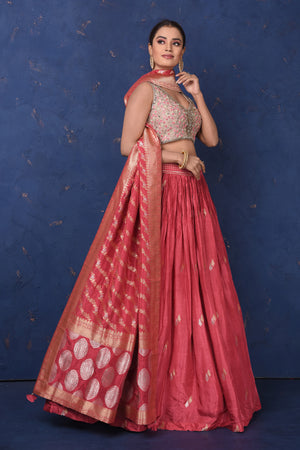 Shop stunning blush pink embroidered lehenga online in USA with dupatta, Be the center of attraction on festive occasions in beautiful designer suits, dresses, lehengas, designer gowns, from Pure Elegance Indian fashion store in USA.-side