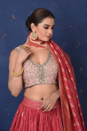 Shop stunning blush pink embroidered lehenga online in USA with dupatta, Be the center of attraction on festive occasions in beautiful designer suits, dresses, lehengas, designer gowns, from Pure Elegance Indian fashion store in USA.-closeup