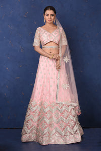 Shop powder pink embroidered net lehenga online in USA with dupatta, Be the center of attraction on festive occasions in beautiful designer suits, dresses, lehengas, designer gowns, from Pure Elegance Indian fashion store in USA.-full view