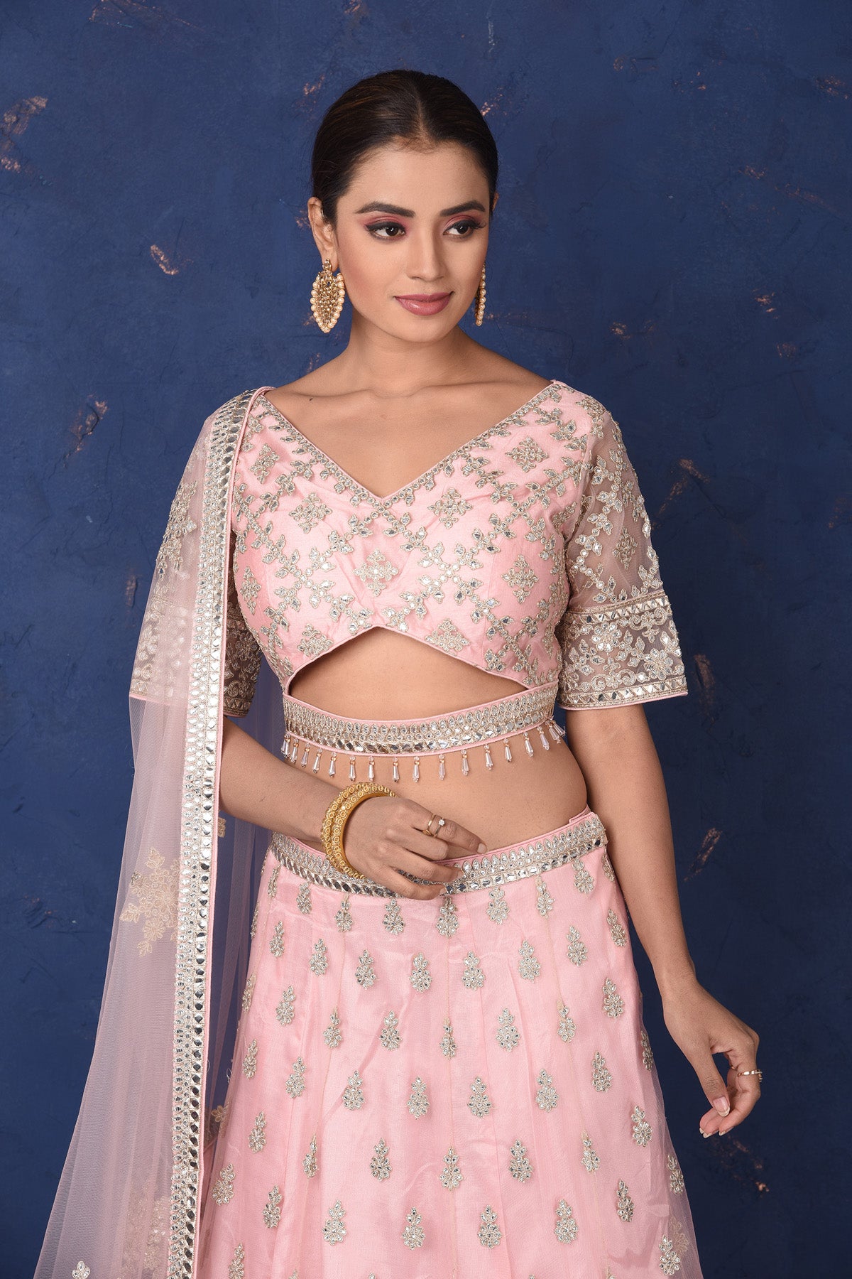 Shop powder pink embroidered net lehenga online in USA with dupatta, Be the center of attraction on festive occasions in beautiful designer suits, dresses, lehengas, designer gowns, from Pure Elegance Indian fashion store in USA.-closeup