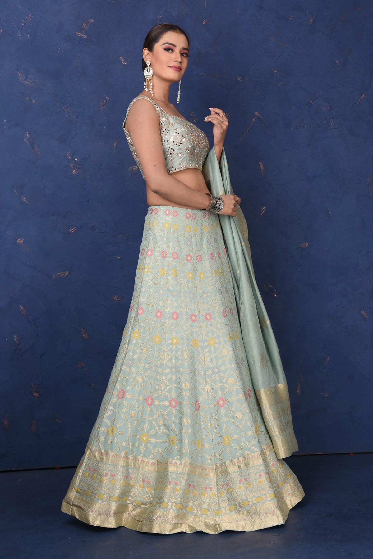 Shop beautiful mint green Banarasi embroidered lehenga online in USA with dupatta, Be the center of attraction on festive occasions in beautiful designer suits, dresses, lehengas, designer gowns, from Pure Elegance Indian fashion store in USA.-side