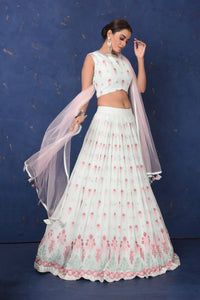 Buy stunning mint green embroidered designer lehenga online in USA with dupatta, Be the center of attraction on festive occasions in beautiful designer suits, dresses, lehengas, designer gowns, from Pure Elegance Indian fashion store in USA.-full view