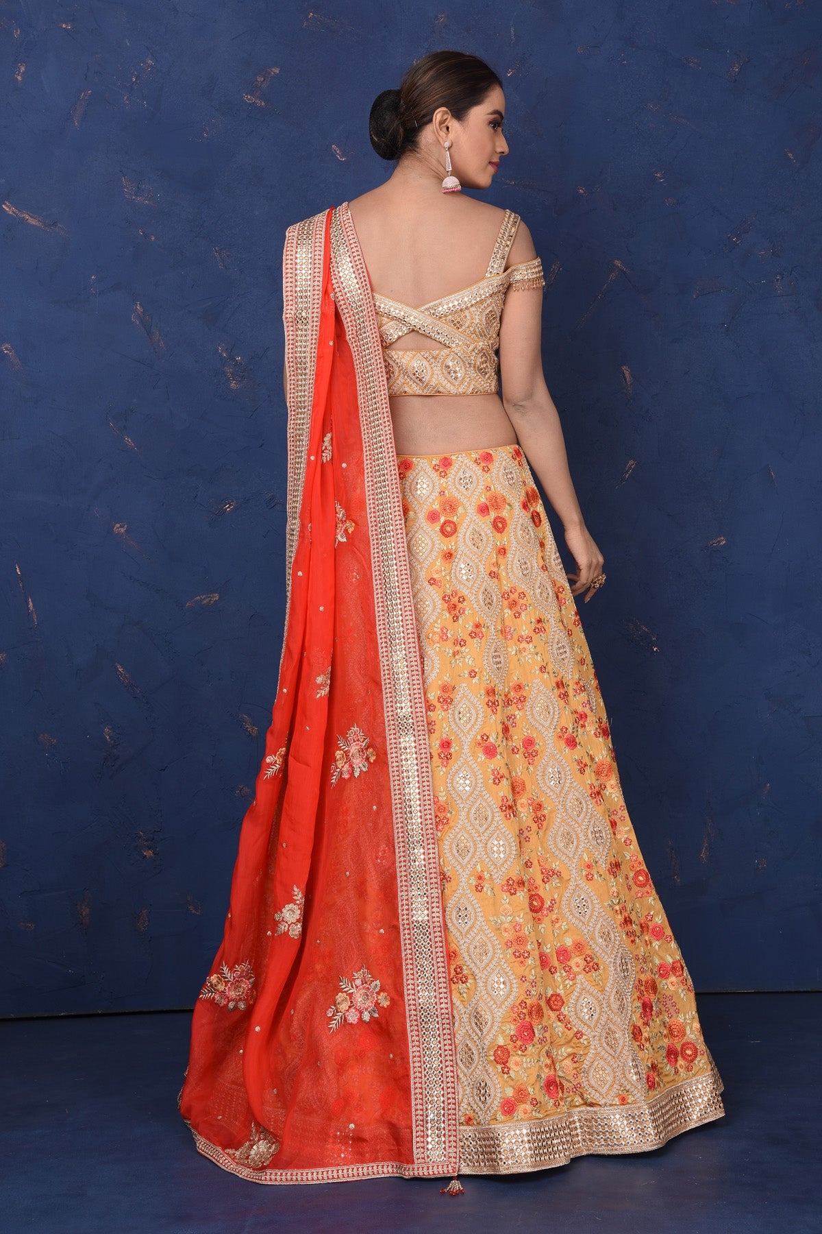 Shop stunning beige designer lehenga online in USA with floral embroidery, Be the center of attraction on festive occasions in beautiful designer suits, dresses, lehengas, designer gowns, from Pure Elegance Indian fashion store in USA.-back