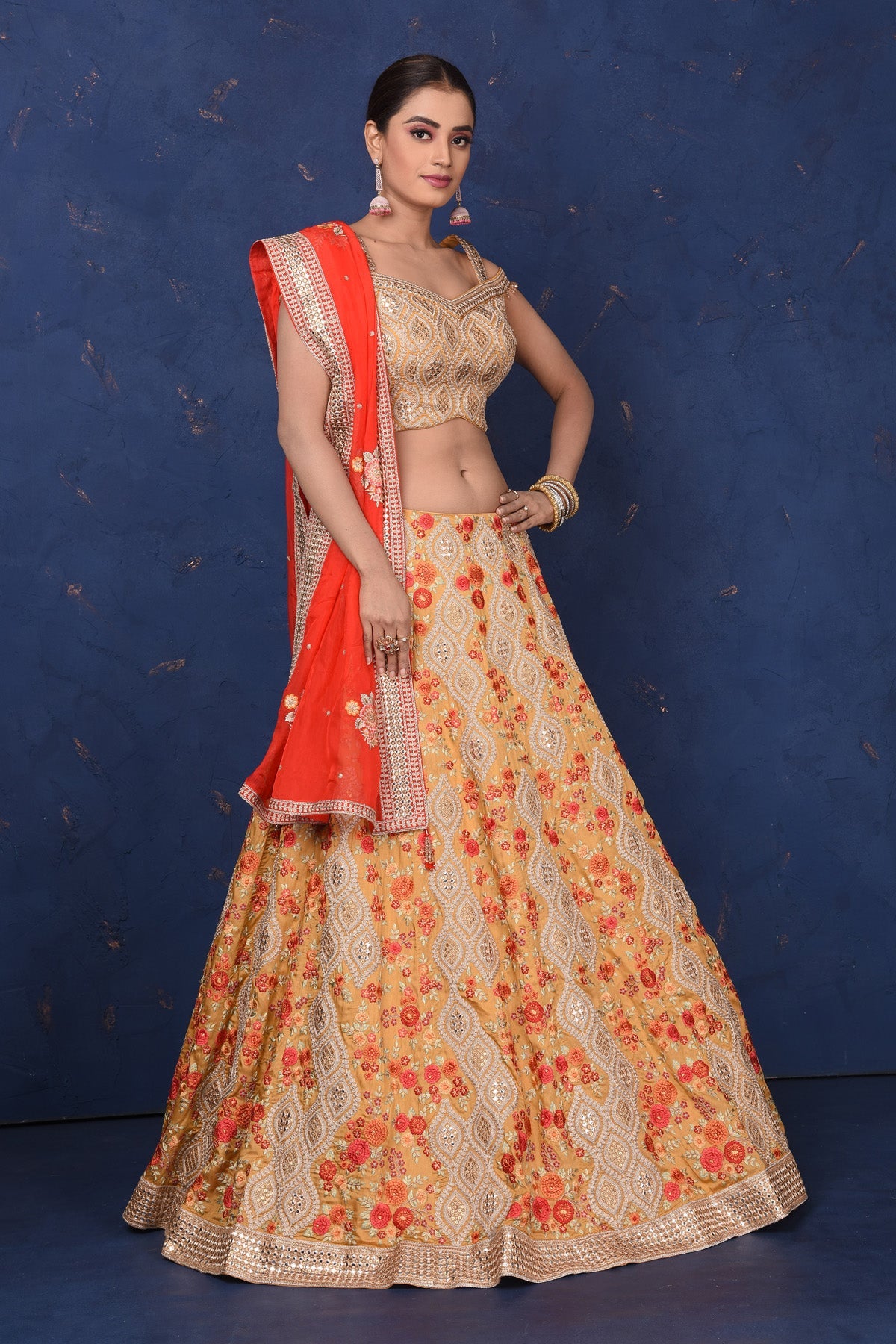 Shop stunning beige designer lehenga online in USA with floral embroidery, Be the center of attraction on festive occasions in beautiful designer suits, dresses, lehengas, designer gowns, from Pure Elegance Indian fashion store in USA.-side