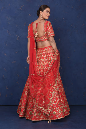 Buy stunning red embroidered designer lehenga online in USA with dupatta, Be the center of attraction on festive occasions in beautiful designer suits, dresses, lehengas, designer gowns, from Pure Elegance Indian fashion store in USA.-back