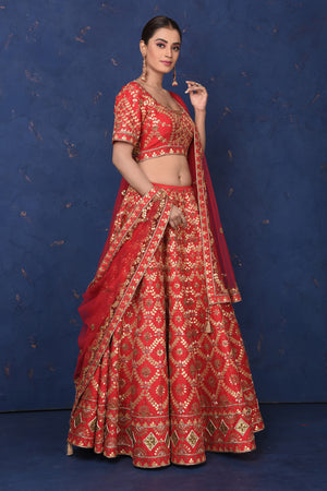 Buy stunning red embroidered designer lehenga online in USA with dupatta, Be the center of attraction on festive occasions in beautiful designer suits, dresses, lehengas, designer gowns, from Pure Elegance Indian fashion store in USA.-side