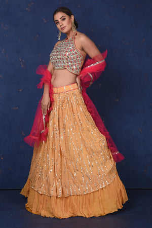 Shop beautiful mustard and golden embroidered contemporary lehenga online in USA. Set fashion goals on special occasions in exclusive designer lehengas, Indian suits, Anarkali dresses, designer gowns, bridal lehengas from Pure Elegance Indian fashion store in USA.-skirt