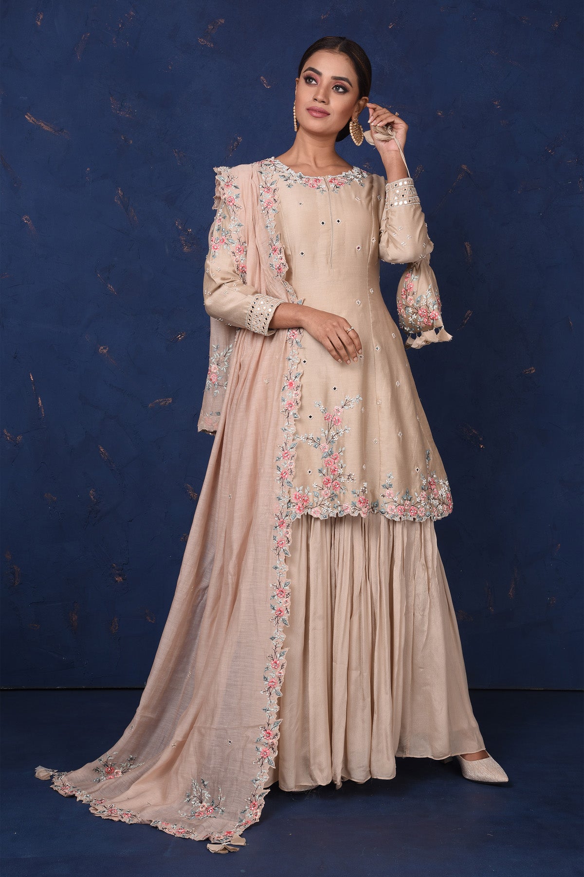 Shop stunning beige embroidered sharara suit online in USA with dupatta. Set fashion goals on special occasions in exclusive designer lehengas, Indian suits, Anarkali dresses, designer gowns, bridal lehengas from Pure Elegance Indian fashion store in USA.-full view