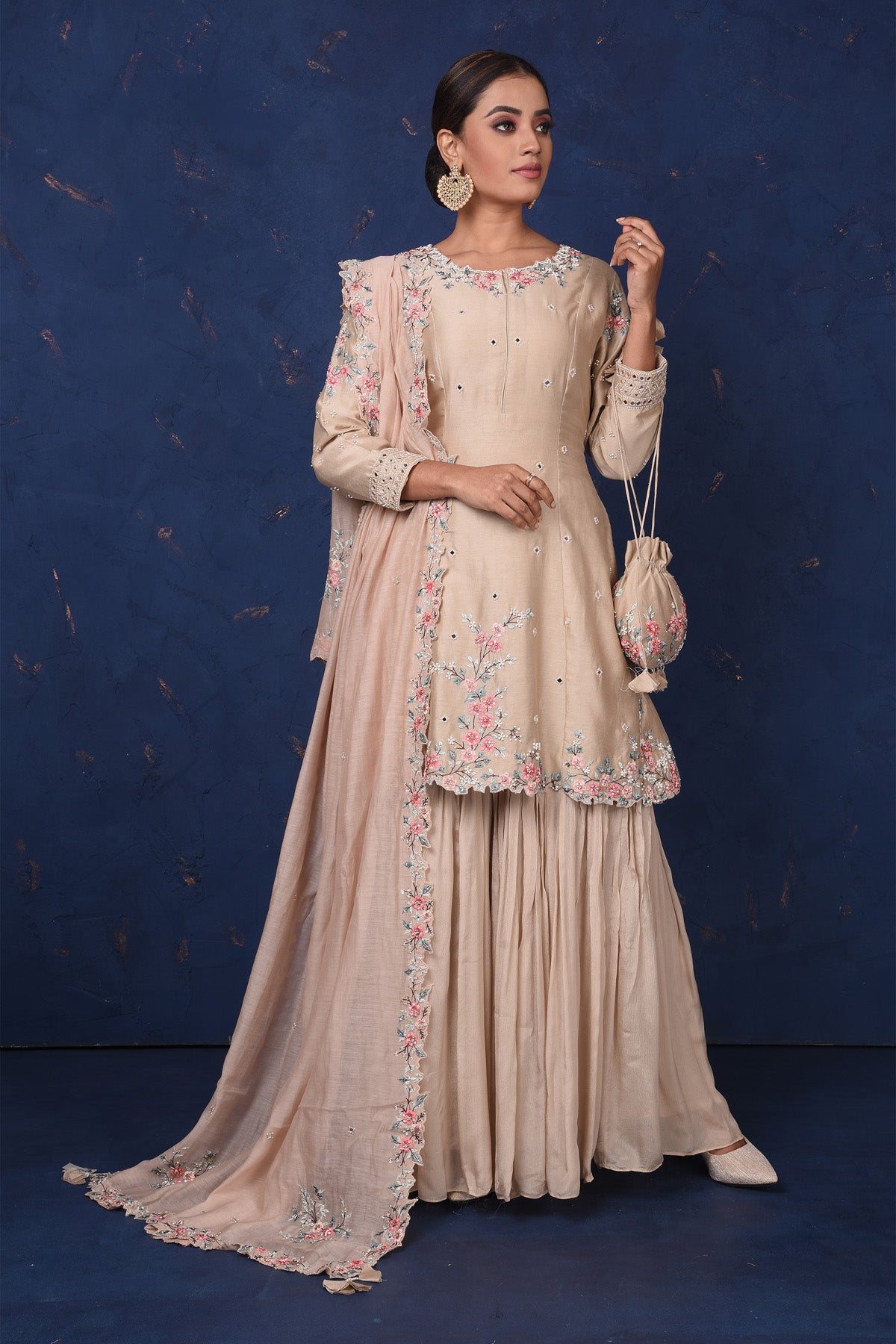 Shop stunning beige embroidered sharara suit online in USA with dupatta. Set fashion goals on special occasions in exclusive designer lehengas, Indian suits, Anarkali dresses, designer gowns, bridal lehengas from Pure Elegance Indian fashion store in USA.-front