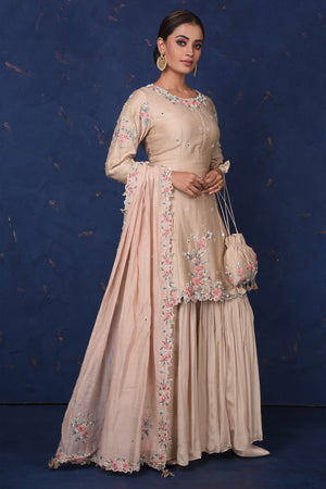 Shop stunning beige embroidered sharara suit online in USA with dupatta. Set fashion goals on special occasions in exclusive designer lehengas, Indian suits, Anarkali dresses, designer gowns, bridal lehengas from Pure Elegance Indian fashion store in USA.-side