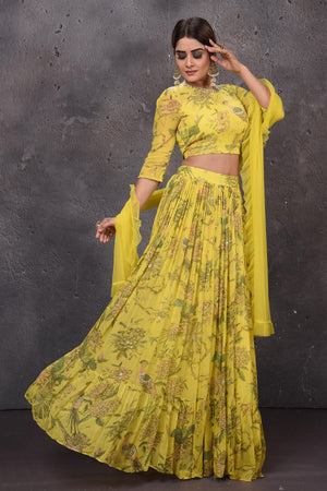 Shop gorgeous yellow floral lehenga online in USA with dupatta. Look royal at weddings in this bespoke designer lehengas, wedding gowns, bridal lehengas, designer sarees, Anarkali suits, sharara suits, from Pure Elegance Indian fashion store in USA.-right