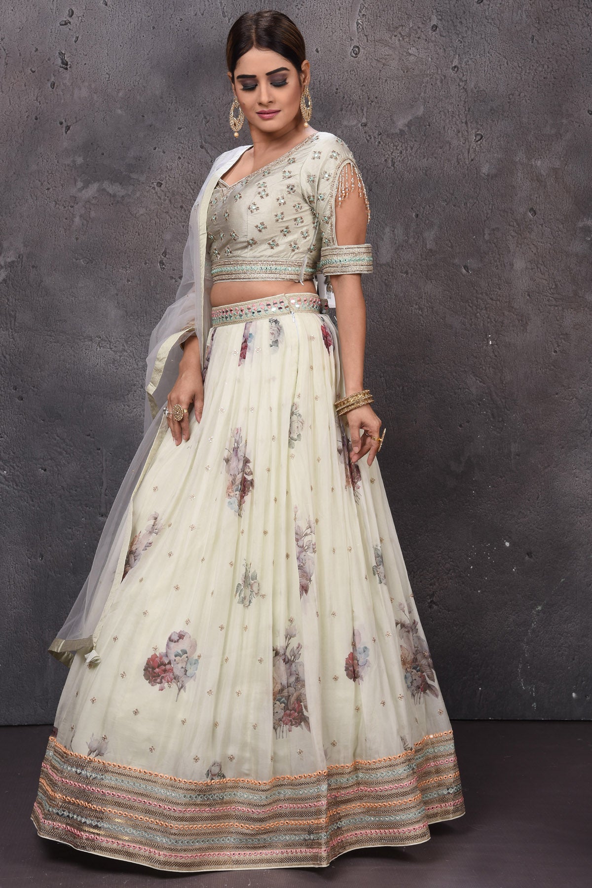 Buy stunning off-white embroidered Anarkali suit online in USA with dupatta. Look royal at weddings in this bespoke designer lehengas, wedding gowns, bridal lehengas, designer sarees, Anarkali suits, sharara suits, from Pure Elegance Indian fashion store in USA.-left