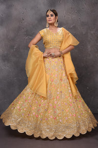 Buy beautiful mango yellow embroidered scalloped lehenga online in USA with dupatta. Look royal at weddings in this bespoke designer lehengas, wedding gowns, bridal lehengas, designer sarees, Anarkali suits, sharara suits, from Pure Elegance Indian fashion store in USA.-full view