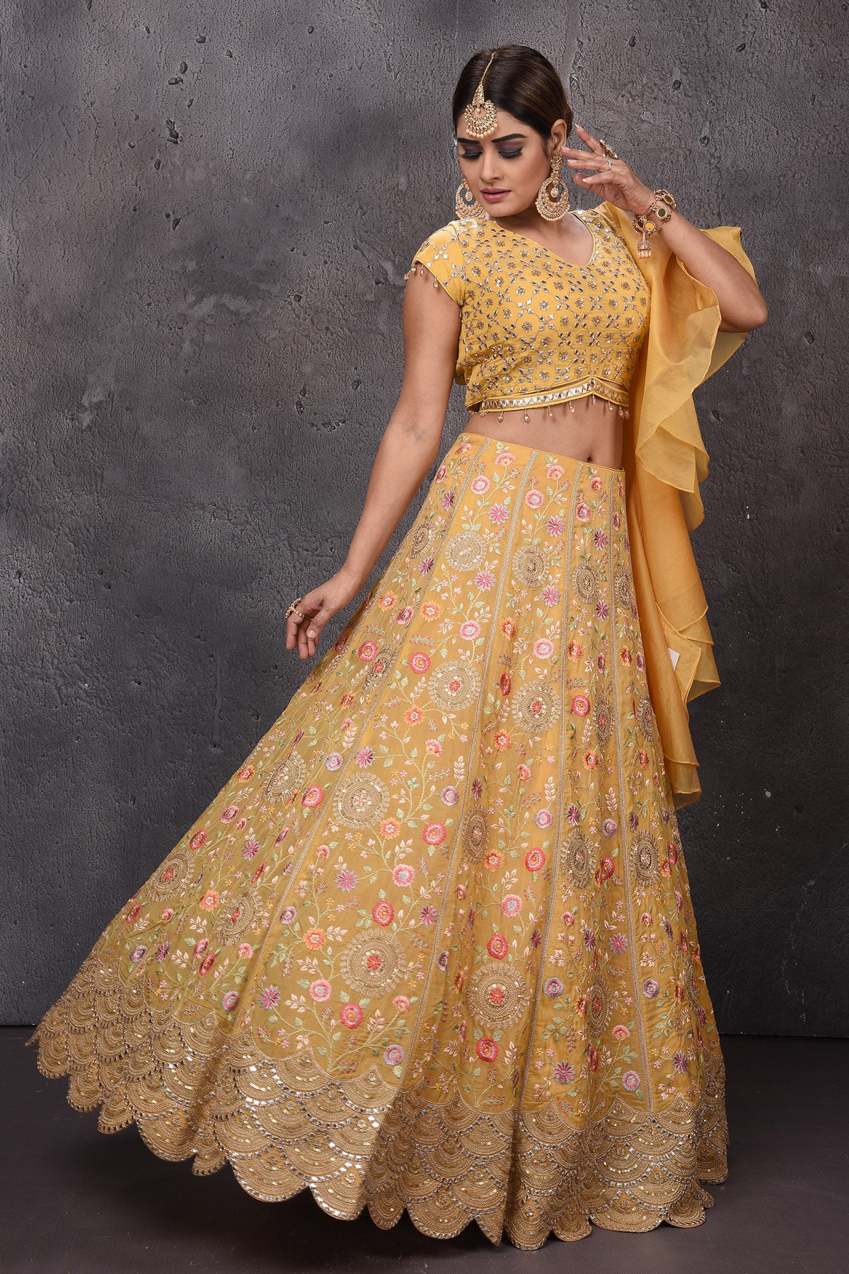 Buy beautiful mango yellow embroidered scalloped lehenga online in USA with dupatta. Look royal at weddings in this bespoke designer lehengas, wedding gowns, bridal lehengas, designer sarees, Anarkali suits, sharara suits, from Pure Elegance Indian fashion store in USA.-side