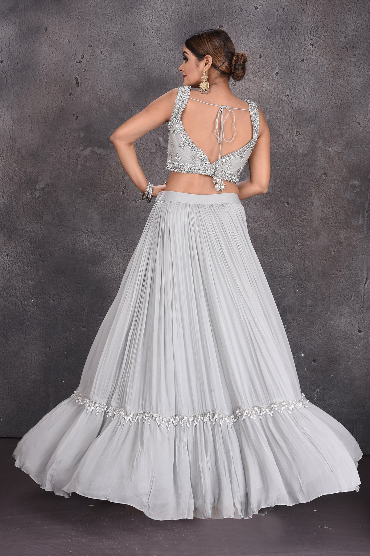 Buy stunning grey contemporary lehenga online in USA with ruffle dupatta. Look royal at weddings in this bespoke designer lehengas, wedding gowns, bridal lehengas, designer sarees, Anarkali suits, sharara suits, from Pure Elegance Indian fashion store in USA.-back