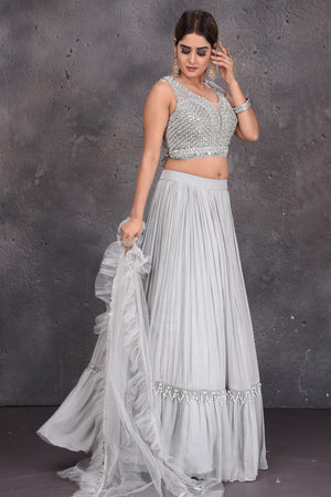 Buy stunning grey contemporary lehenga online in USA with ruffle dupatta. Look royal at weddings in this bespoke designer lehengas, wedding gowns, bridal lehengas, designer sarees, Anarkali suits, sharara suits, from Pure Elegance Indian fashion store in USA.-side