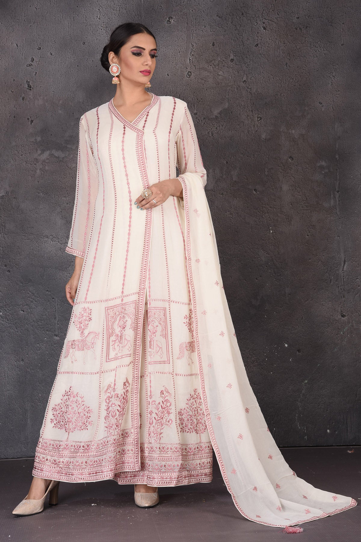 Buy gorgeous cream embroidered floorlength suit online in USA with dupatta. Look elegant at weddings and festive occasions in exclusive designer suits, designer gowns, Anarkali suits, sharara suits, bridal gowns, palazzo suits from Pure Elegance Indian clothing store in USA.-full view