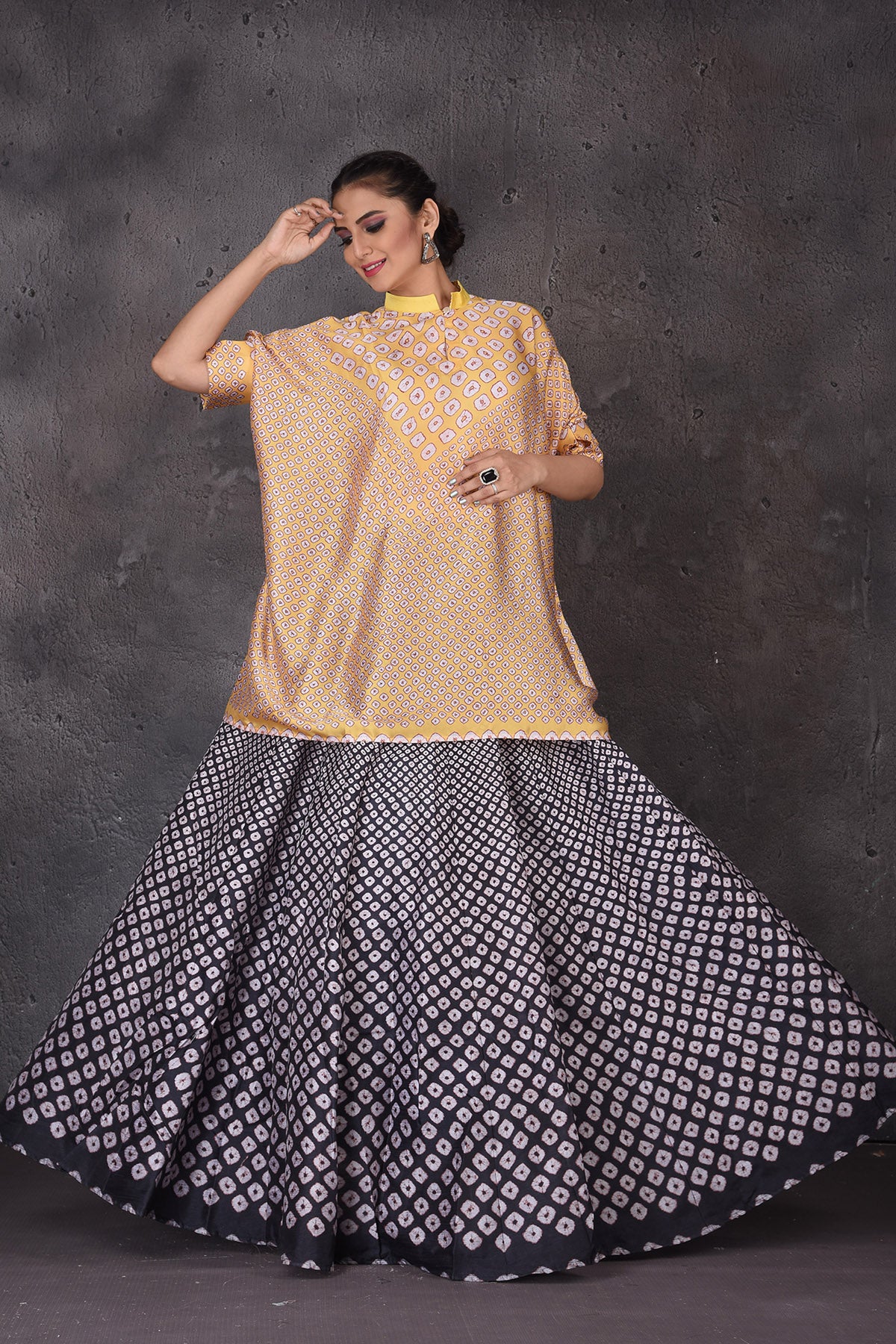 Buy stunning yellow and black Bandhej print skirt set online in USA. Look elegant at weddings and festive occasions in exclusive designer suits, designer gowns, Anarkali suits, sharara suits, bridal gowns, palazzo suits, designer lehenga from Pure Elegance Indian clothing store in USA.-full view