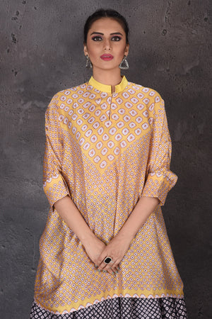 Buy stunning yellow and black Bandhej print skirt set online in USA. Look elegant at weddings and festive occasions in exclusive designer suits, designer gowns, Anarkali suits, sharara suits, bridal gowns, palazzo suits, designer lehenga from Pure Elegance Indian clothing store in USA.-closeup